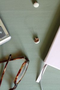 calculator and notebook to learn how to budget